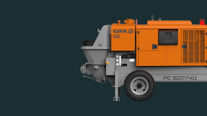 Orange and gray CIFA concrete pump on a dark background